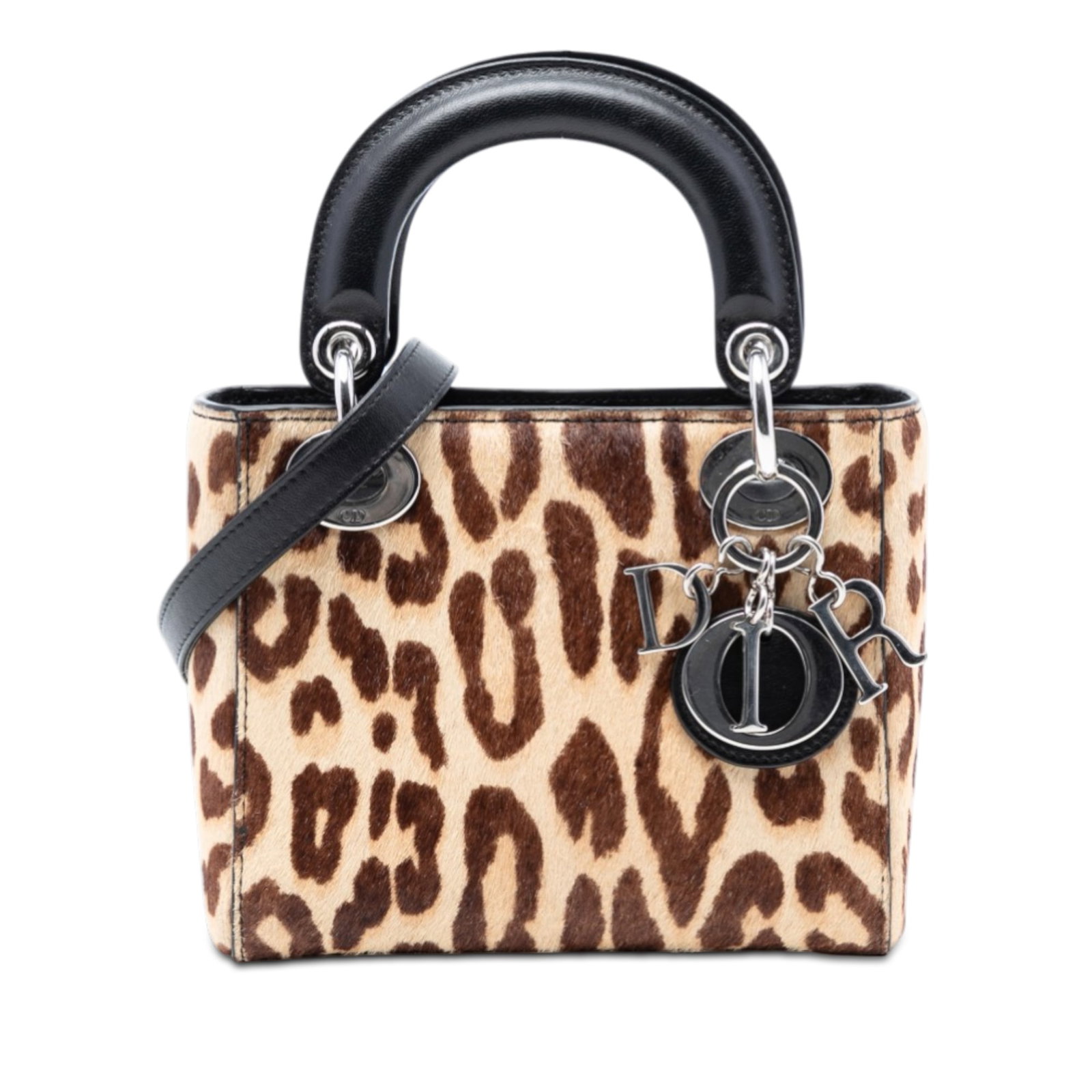 Dior Mini Lady Dior Bag in Leopard Pony Hair With Leather Trim: Dior Mini Lady Dior Bag in Leopard Pony Hair With Leather Trim This Mini Lady Dior bag showcases a striking leopard print pony hair body, complemented by leather trim and silver-tone hardware. It feat