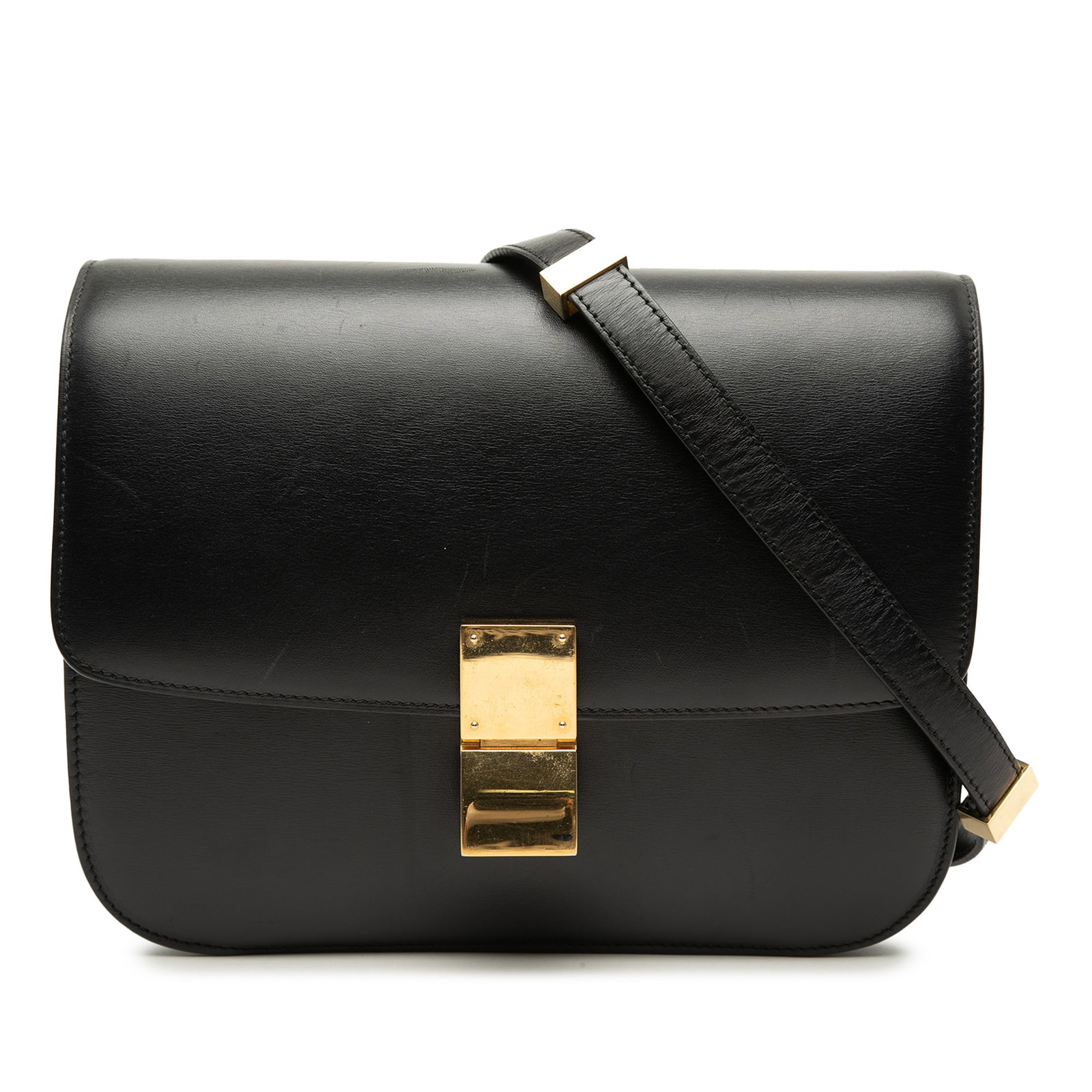Celine Medium Classic Box Black Leather Crossbody Bag: Celine Medium Classic Box Black Leather Crossbody Bag Celine Medium Calfskin Classic Box crossbody bag in black leather. This bag features a structured leather body, a flat leather strap, a front flap