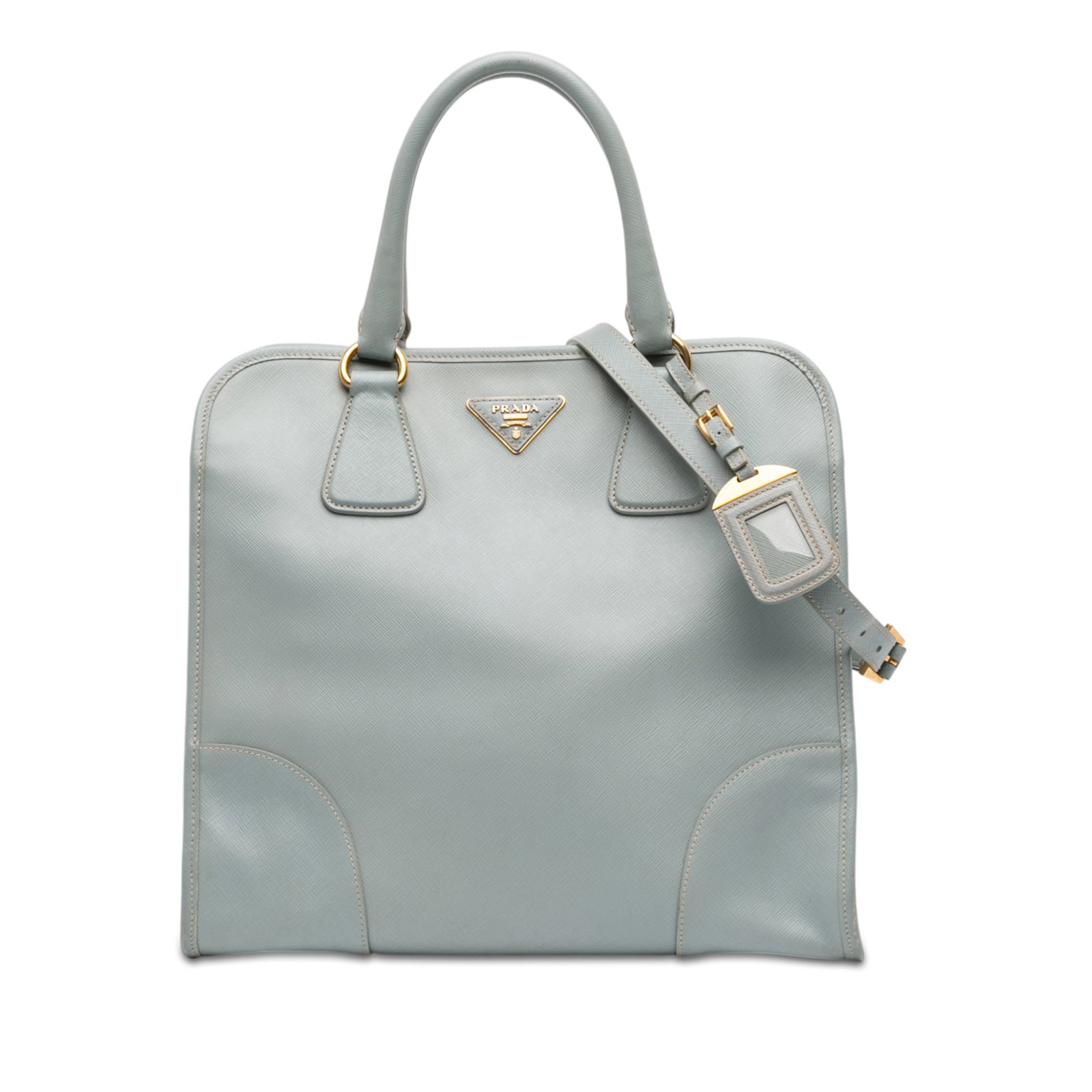 Prada Saffiano Lux Blue Leather Tote Bag with Detachable Strap: Prada Saffiano Lux Blue Leather Tote Bag with Detachable Strap This Prada Saffiano Lux Shopping Tote showcases a blue saffiano leather body with rolled leather handles and a detachable flat leather st