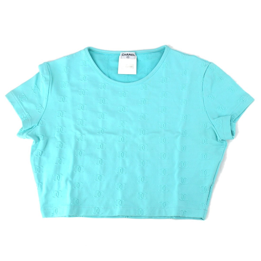 CHANEL 97P Cropped Short Sleeve T Shirt Size 40 Blue: CHANEL 97P Cropped Short Sleeve T Shirt Size 40 Blue Cropped round neck short sleeve top in light blue from Chanel's 97P collection. This women's T-shirt is made in France from a nylon and spandex ble