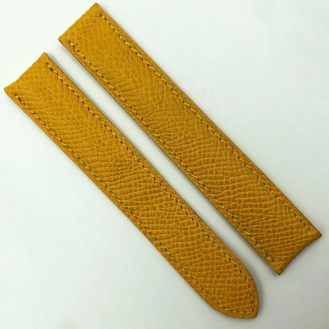 Cartier 17mm Yellow Leather Watch Strap for Deployant Clasp: Cartier 17mm Yellow Leather Watch Strap for Deployant Clasp Enhance your timepiece with this authentic Cartier 17mm yellow leather strap designed for a deployant clasp. This two-piece wristwatch band 