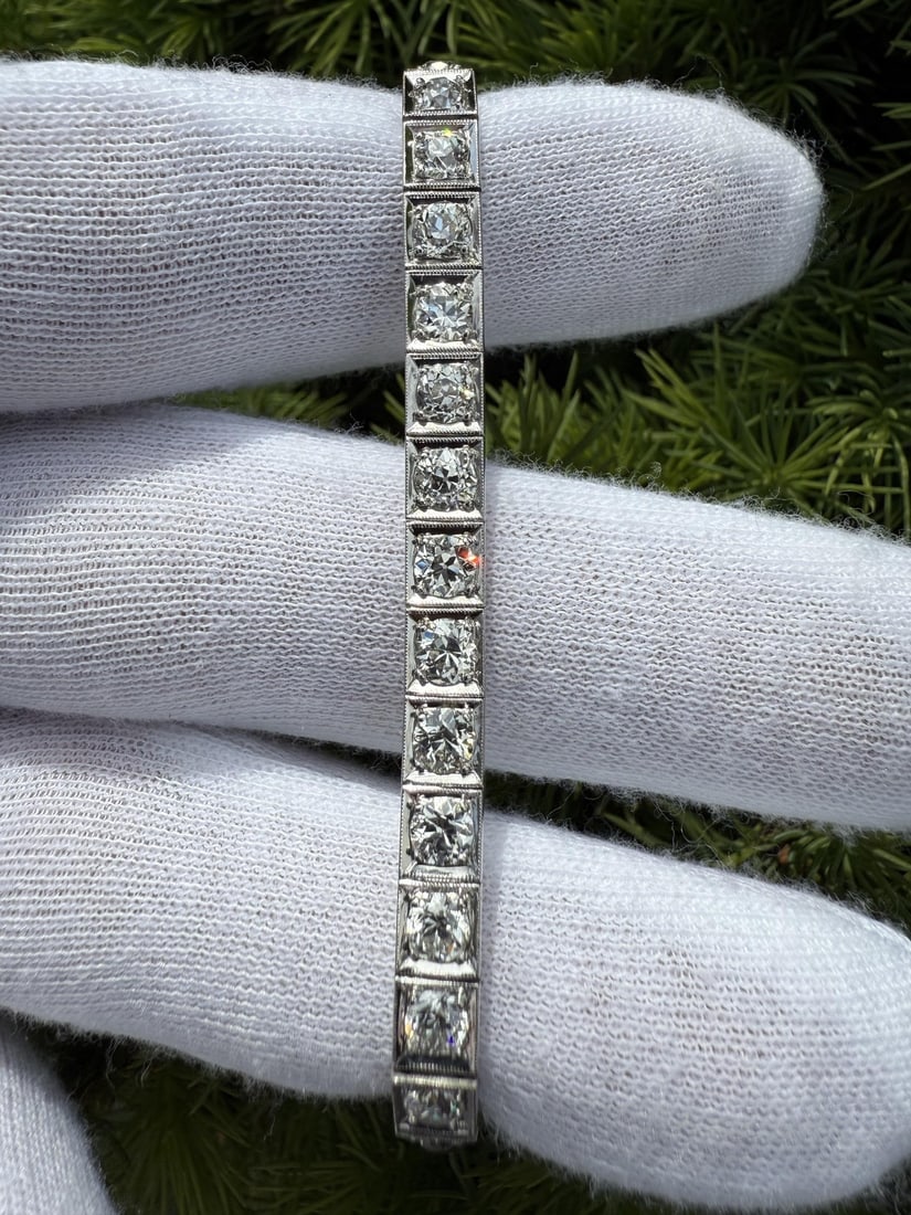 Art Deco Platinum Diamond Tennis Bracelet 32 Stones 6.75 in: Art Deco Platinum Diamond Tennis Bracelet 32 Stones 6.75 in This antique Art Deco tennis bracelet features 32 natural old European cut diamonds with a total carat weight of approximately 8.0 carats. T