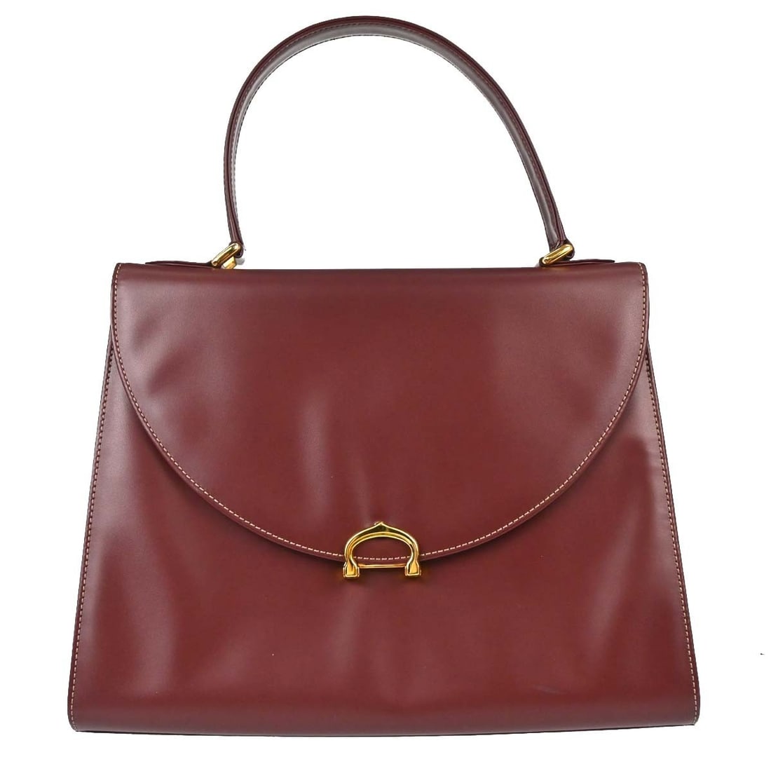 Cartier leather top handle handbag in Bordeaux with logo charm: Cartier leather top handle handbag in Bordeaux with logo charm Vintage Cartier top handle handbag in wine burgundy leather. This medium bag features a structured silhouette with pockets and a top hand