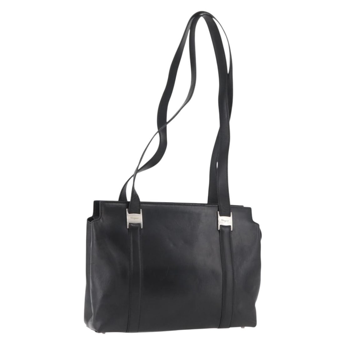 Salvatore Ferragamo black silver leather tote bag Italy: Salvatore Ferragamo black silver leather tote bag Italy This Salvatore Ferragamo tote bag is crafted from black leather with silver-tone accents. Made in Italy, it features a spacious interior and a c