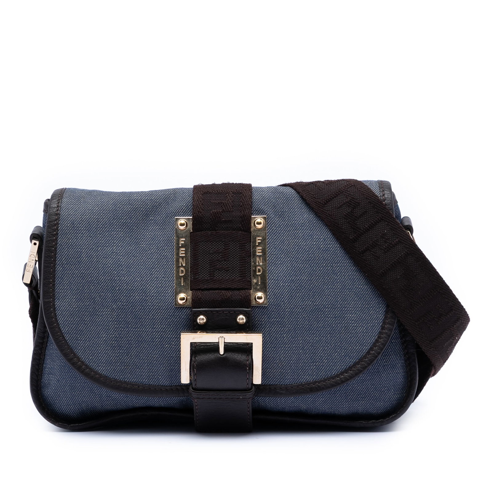 Fendi Zucca Denim Crossbody Bag with Buckle Flap and Leather Trim: Fendi Zucca Denim Crossbody Bag with Buckle Flap and Leather Trim This Fendi Zucca Trimmed Denim Buckle Flap crossbody bag features a denim body with leather trim, an adjustable flat strap, a front fl