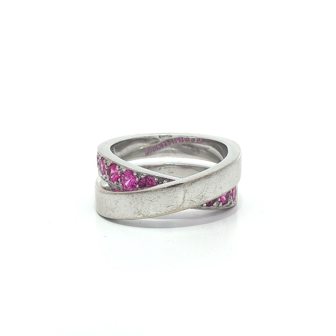 Cartier 18k White Gold Pink Sapphire Crossover Ring 1.5ct: Cartier 18k White Gold Pink Sapphire Crossover Ring 1.5ct Presenting the exquisite Cartier 18k White Gold Crossover Ring, featuring a stunning array of 11 natural pink sapphires. Each round brilliant 