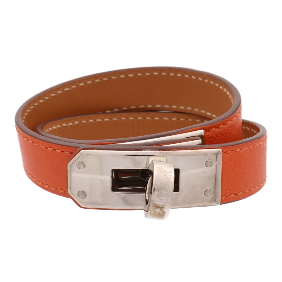 Hermes Kelly Double Tour Orange Calfskin Bracelet Palladium Hardware: Hermes Kelly Double Tour Orange Calfskin Bracelet Palladium Hardware This Hermes Kelly Double Tour bracelet is crafted from Swift leather in a vibrant orange color. Designed with a double tour style, 