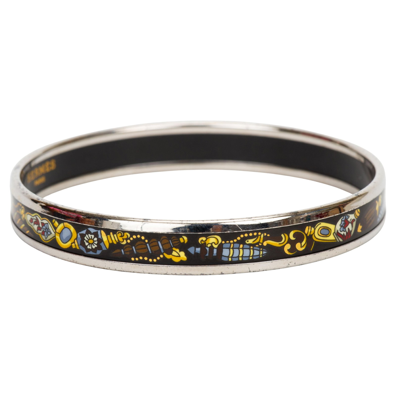 Hermes Narrow Enamel Bangle with Multi Color Print: Hermes Narrow Enamel Bangle with Multi Color Print This Hermes Enamel Print Narrow Bangle features a multicolor print set against a black background with silver-toned edges. Crafted in France in 2010,