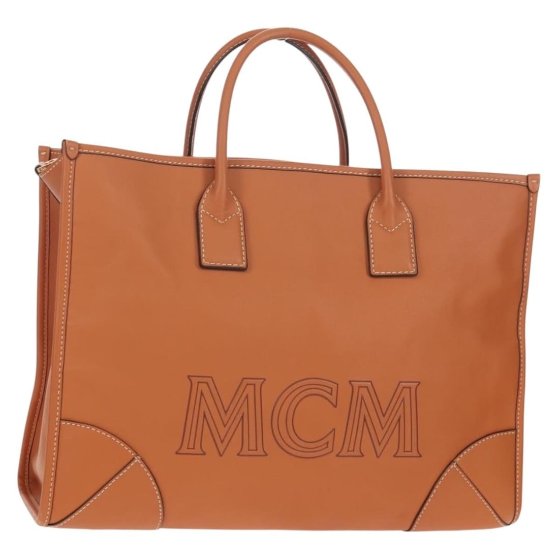 MCM Brown Leather Handbag with Dust Bag Korea: MCM Brown Leather Handbag with Dust Bag Korea MCM women's leather handbag in brown with gold-tone accents. Includes a dust bag and is made in Korea. Condition is AB, described as very good, with sligh