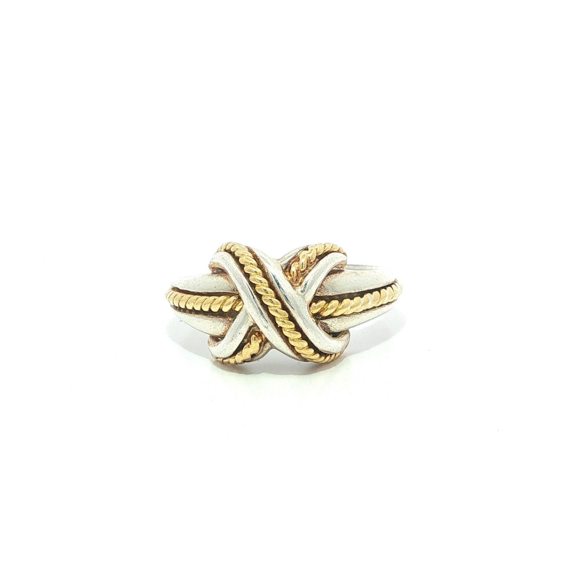 Tiffany & Co. X Band Ring Sterling Silver 18k Yellow Gold 1990: Tiffany & Co. X Band Ring Sterling Silver 18k Yellow Gold 1990 This Tiffany & Co. Signature "X" band ring from 1990 features a striking combination of solid sterling silver and 18k yellow gold. Design