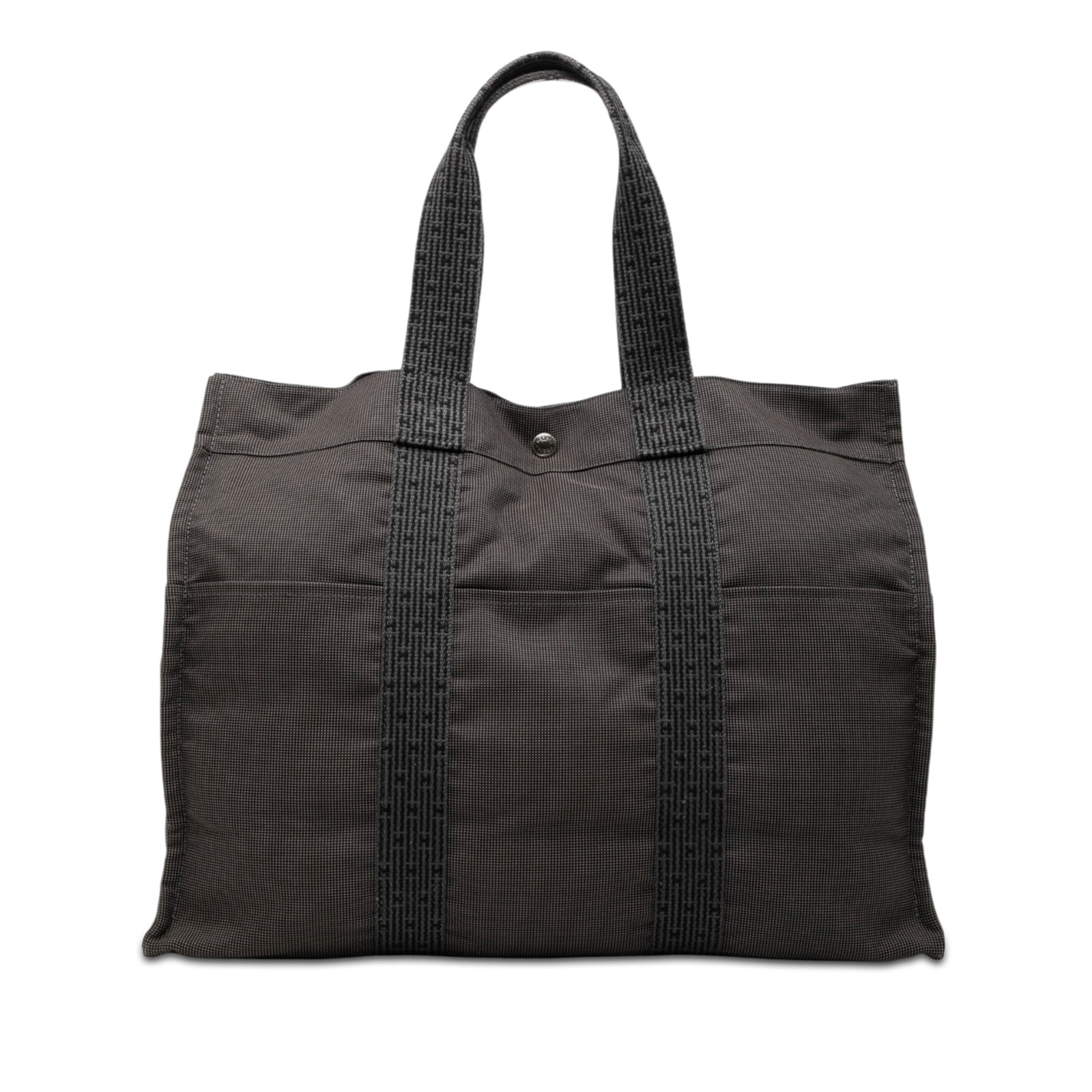 Hermes Herline GM Gray Canvas Tote: Hermes Herline GM Gray Canvas Tote The Hermes Herline GM tote is crafted from durable canvas in a gray color. It features flat straps, an open top with both snap and zip closures, exterior slip pocket