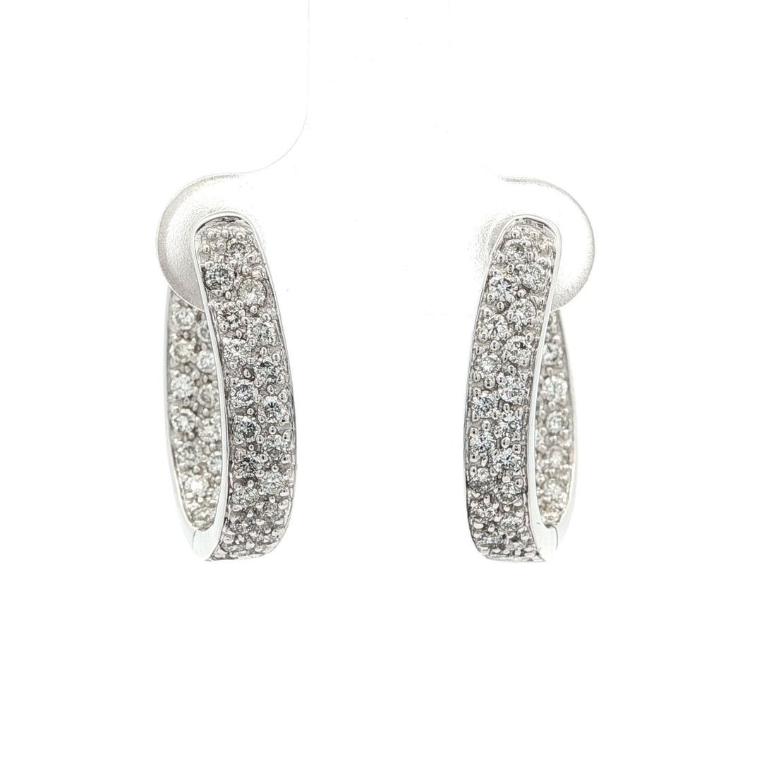 14k White Gold Curved Hoop Earrings 0.70ctw Diamond Pave Set: 14k White Gold Curved Hoop Earrings 0.70ctw Diamond Pave Set Elevate your style with these exquisite 14k White Gold Pave Diamond In & Out Curved Hinged Hoop Earrings. Featuring a stunning array of 70 