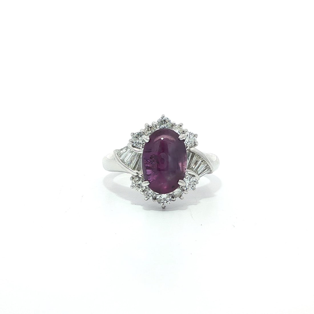 GIA Certified 4.71ct Oval Cabochon Purple Star Sapphire Diamond Ring in Platinum: GIA Certified 4.71ct Oval Cabochon Purple Star Sapphire Diamond Ring in Platinum This exquisite cocktail ring features a stunning natural purple star sapphire, expertly crafted in an elegant platinum 