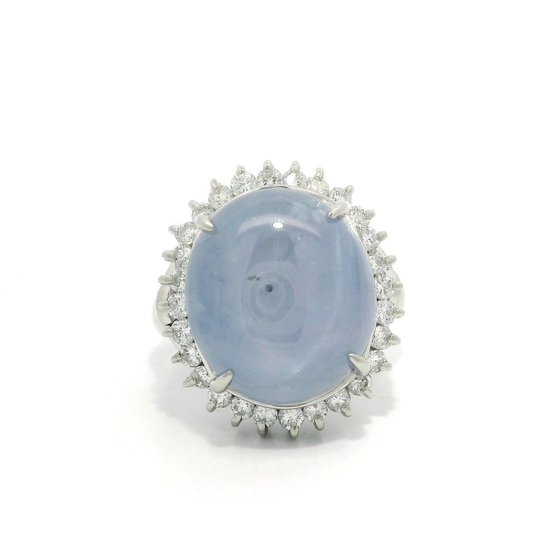 15.56ctw Periwinkle Blue Star Sapphire Diamond Halo Ring in Platinum: 15.56ctw Periwinkle Blue Star Sapphire Diamond Halo Ring in Platinum This stunning cocktail ring features a captivating natural genuine star sapphire, expertly crafted in an oval cabochon cut, showcas