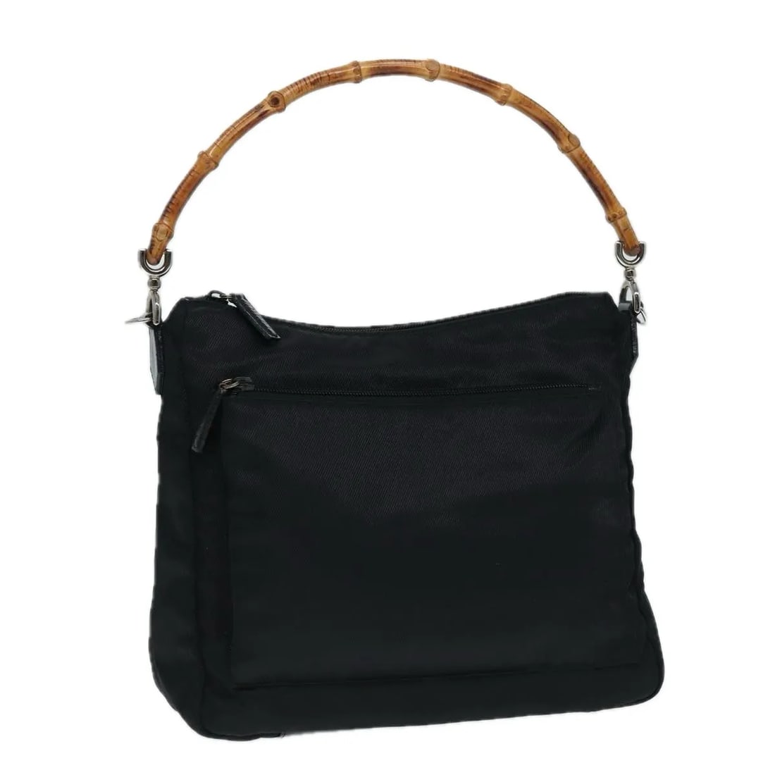 Black Nylon Gucci Vintage Bamboo Handle Tote: Black Nylon Gucci Vintage Bamboo Handle Tote This Gucci Vintage Bamboo Handle Bag is crafted from black nylon and features the iconic bamboo handle design. Made in Italy, it offers a spacious interior