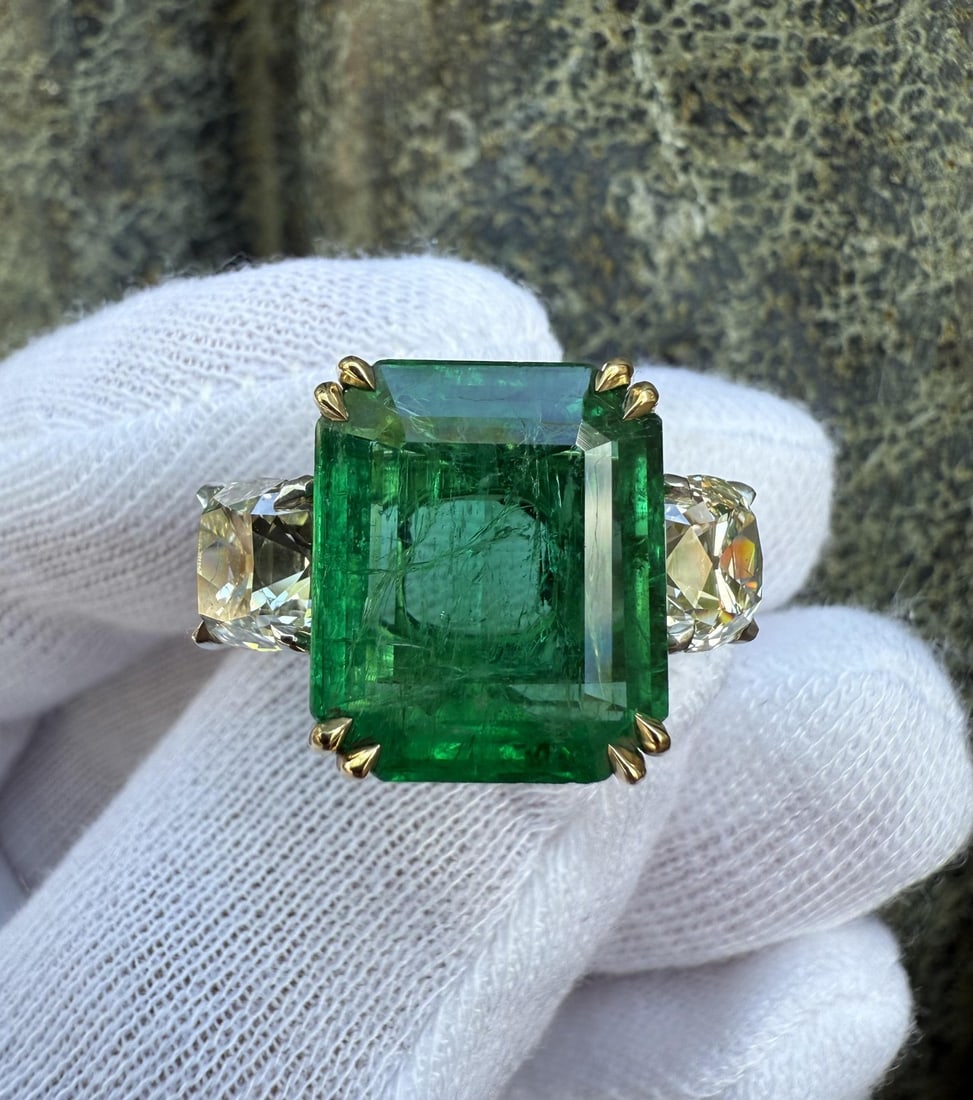 GIA Certified Emerald Diamond Cocktail Ring in Platinum and 18k Gold: GIA Certified Emerald Diamond Cocktail Ring in Platinum and 18k Gold Custom cocktail ring featuring a natural emerald center stone with two old mine cut diamond side stones. Crafted in solid .900+ pla