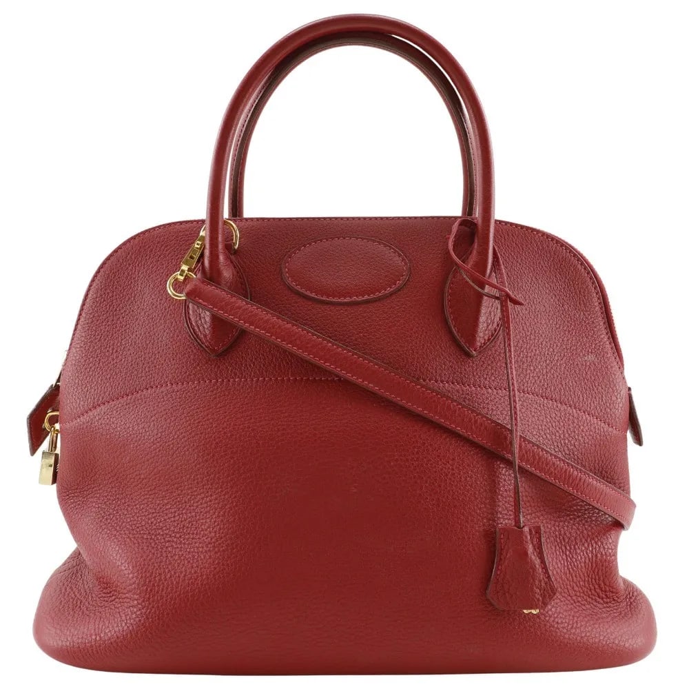 Red Leather Hermes Bolide Clemence Handbag 35cm: Red Leather Hermes Bolide Clemence Handbag 35cm This Hermes Bolide handbag is crafted from red leather and designed for women. It measures 35cm x 25cm x 14cm and features signs of use including exteri