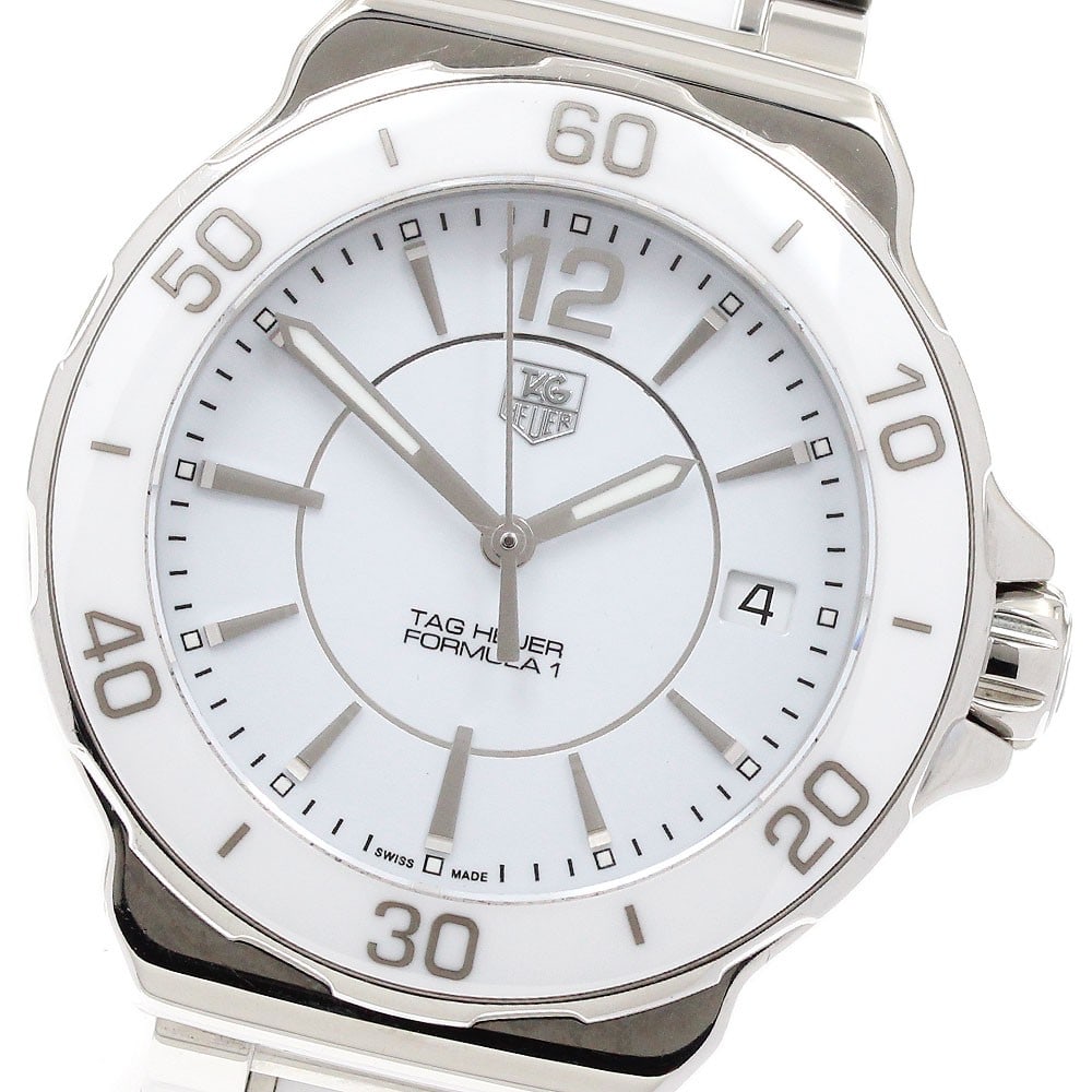 TAG Heuer Formula 1 White Dial Quartz Ladies Watch WAH1211: TAG Heuer Formula 1 White Dial Quartz Ladies Watch WAH1211 This TAG Heuer Formula 1 Date Quartz women's wristwatch features a stainless steel and ceramic case and bracelet with a white dial. The watch