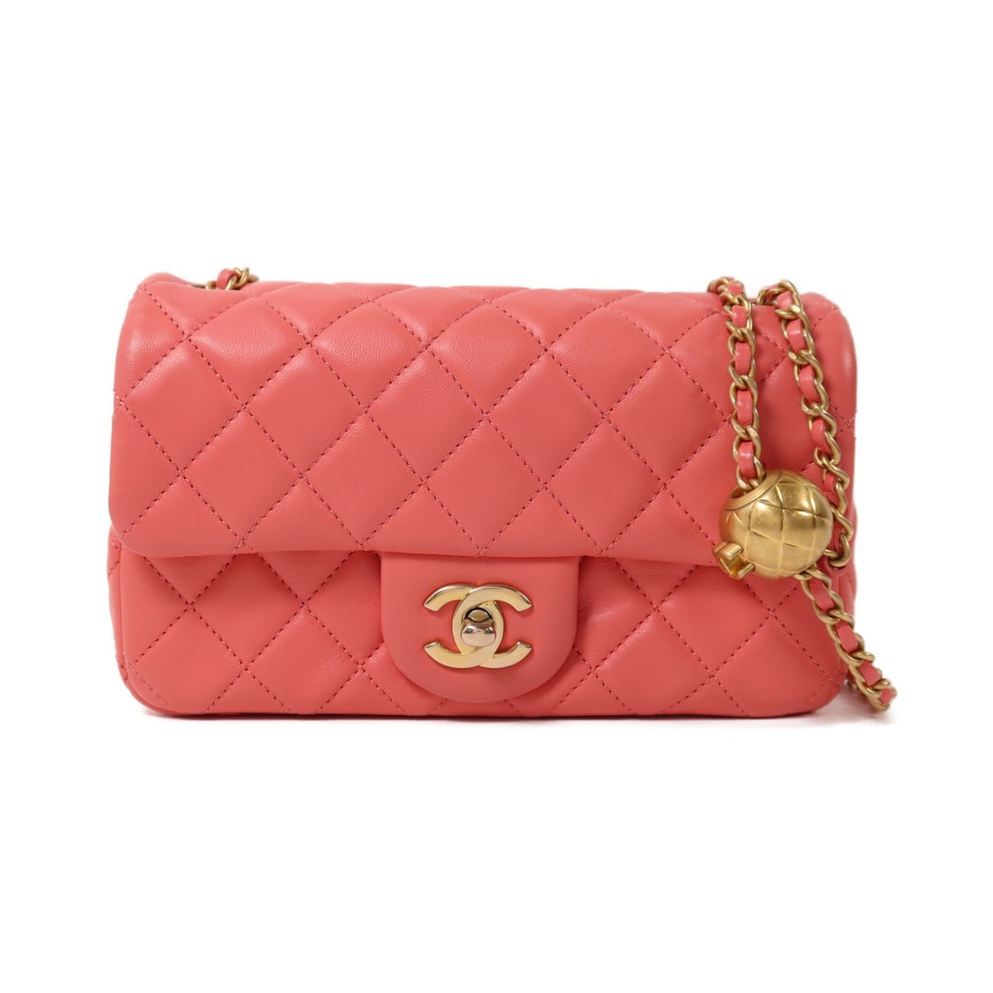Chanel Mini Classic Lambskin Shoulder Bag with Gold Hardware in Pink: Chanel Mini Classic Lambskin Shoulder Bag with Gold Hardware in Pink This CHANEL Mini Classic 20 chain shoulder bag features a pink lambskin leather exterior and gold-tone CC hardware. With a compact 
