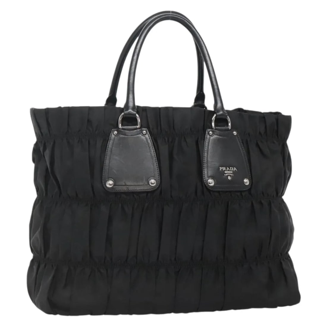 Black Nylon Gaufre Tote Bag by Prada 37cm by 30cm by 14cm: Black Nylon Gaufre Tote Bag by Prada 37cm by 30cm by 14cm This Prada Gaufre Tote for women is crafted from black nylon, featuring a spacious design ideal for everyday use. It shows slight signs of wea