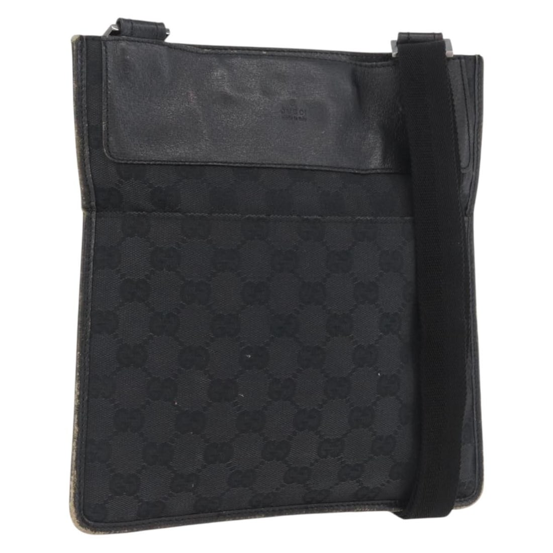 Black GG Canvas Shoulder Bag by Gucci with Silver Accents 27639: Black GG Canvas Shoulder Bag by Gucci with Silver Accents 27639 This GUCCI GG Canvas Shoulder Bag features a black and silver GG canvas exterior and is designed for women. The bag includes an adjustab