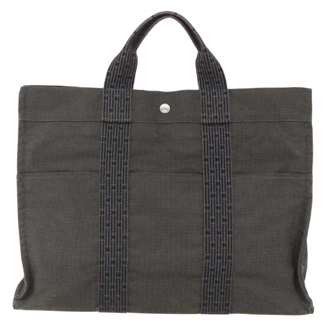 Hermes Fourre-tout Herline gray canvas handbag 44cm x 32cm x 10cm: Hermes Fourre-tout Herline gray canvas handbag 44cm x 32cm x 10cm The Hermes Fourre-tout Herline is a pre-owned women's handbag crafted from gray canvas. It features spacious interior compartments and