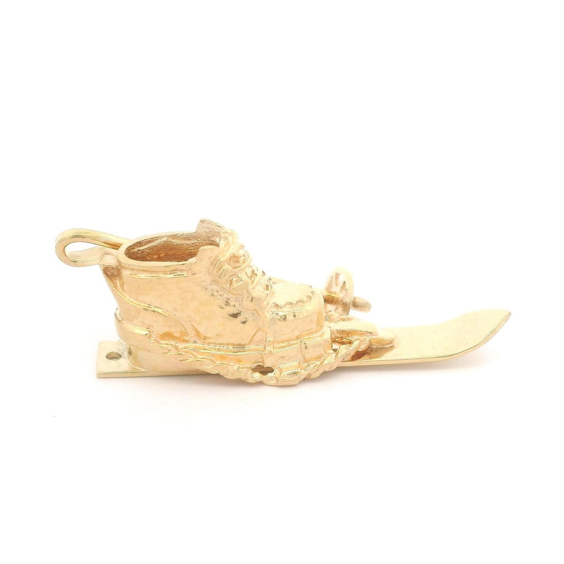 Vintage 14k Yellow Gold Snow Boot Ski Pole Charm Pendant: Vintage 14k Yellow Gold Snow Boot Ski Pole Charm Pendant This vintage collectible charm pendant features a beautifully detailed design of a snow boot and ski pole, crafted from solid 14k yellow gold. 