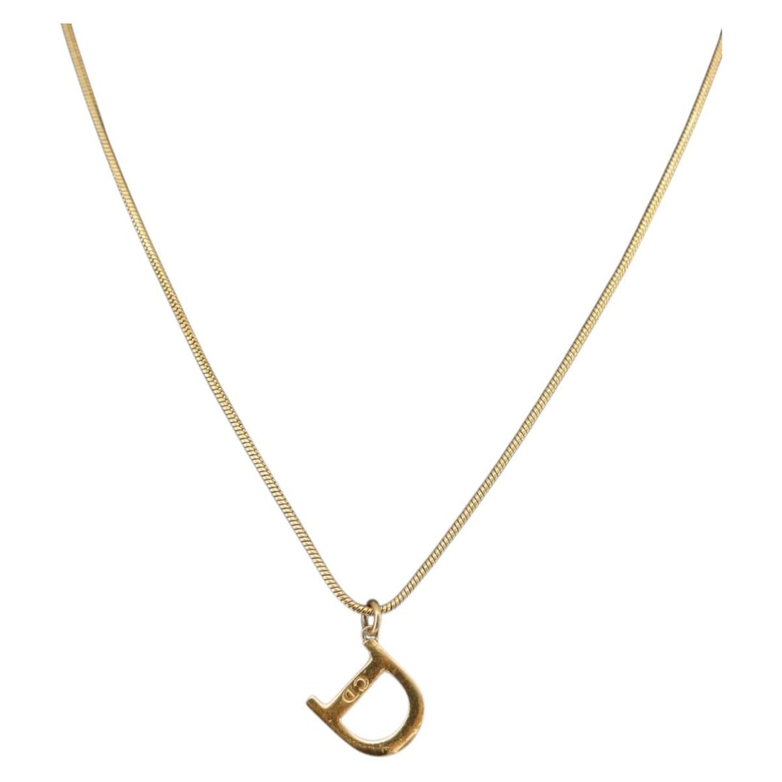 Gold Metal D Pendant Necklace by Christian Dior 17.7 Inch: Gold Metal D Pendant Necklace by Christian Dior 17.7 Inch This Christian Dior women's necklace features a gold-tone metal construction and a distinctive D pendant design. Made in Italy, the necklace m