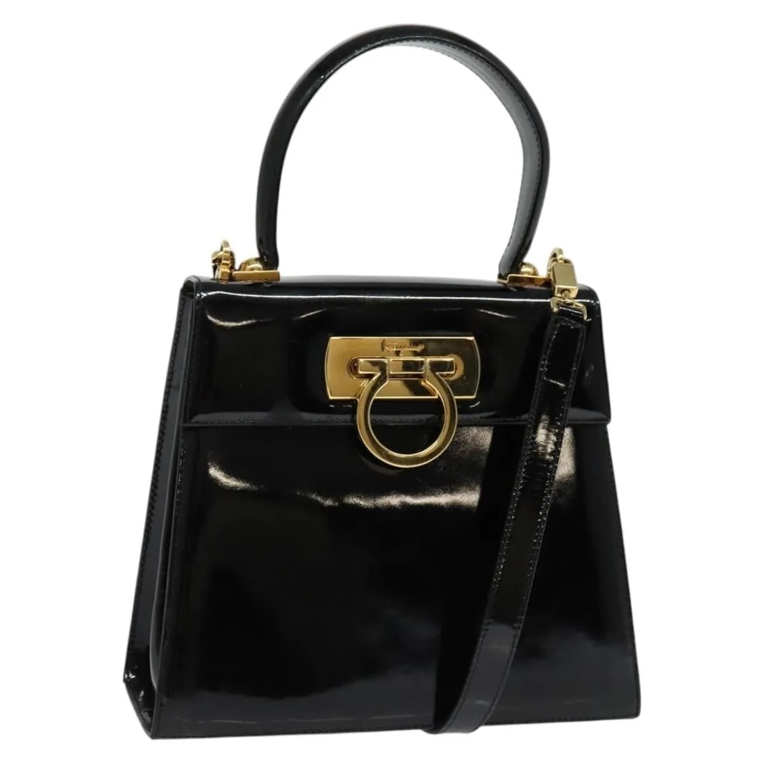 Gancini Black Patent Leather Convertible Bag by Salvatore Ferragamo: Gancini Black Patent Leather Convertible Bag by Salvatore Ferragamo This Salvatore Ferragamo Gancini Convertible Top Handle Bag is crafted from black patent leather and designed for women. It features