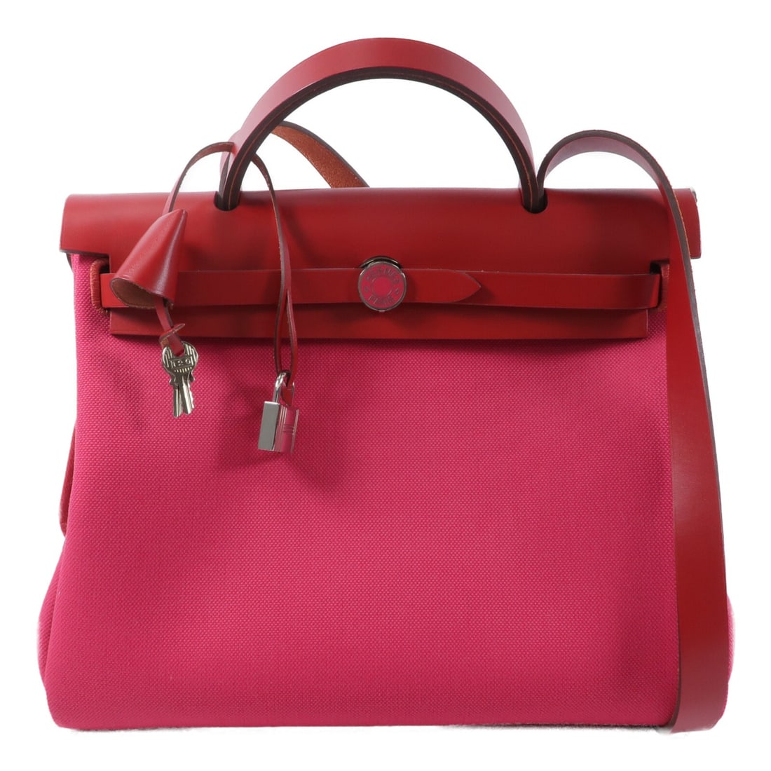Hermes Herbag PM Pink Canvas 2 Way Shoulder Handbag: Hermes Herbag PM Pink Canvas 2 Way Shoulder Handbag This Hermes Herbag PM is a versatile 2-way shoulder handbag crafted from durable canvas in a striking pink hue. The bag features a practical design 