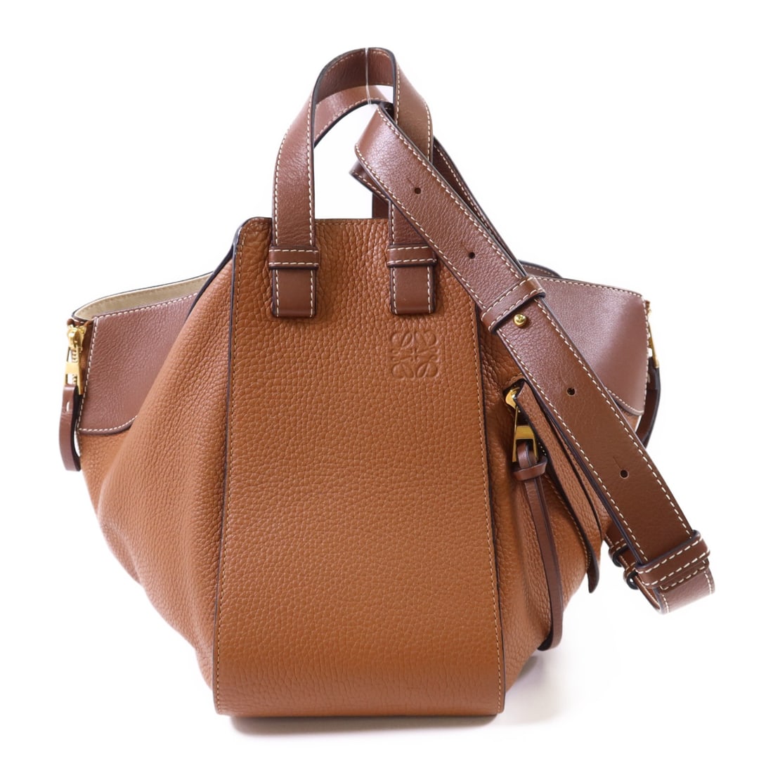 Loewe Hammock Small Brown Calfskin Shoulder Bag with Gold Hardware: Loewe Hammock Small Brown Calfskin Shoulder Bag with Gold Hardware This LOEWE Hammock Small Shoulder Bag features brown calfskin leather and a sleek, contemporary silhouette. The bag is crafted in Spa