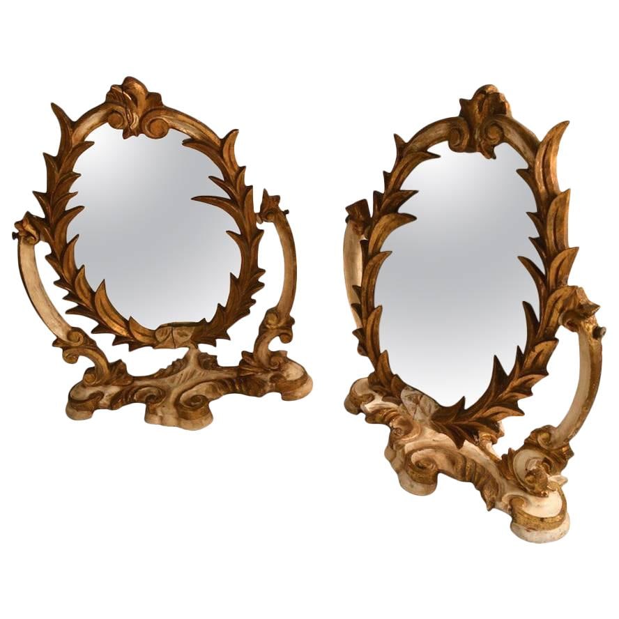 Pair of Venetian Carved Gilt Easel Mirrors 15.5 H x 10.5 W: Pair of Venetian Carved Gilt Easel Mirrors 15.5 H x 10.5 W Enhance your decor with this exquisite pair of Venetian parcel-gilt easel mirrors. Crafted from carved wood, these mirrors feature an origina
