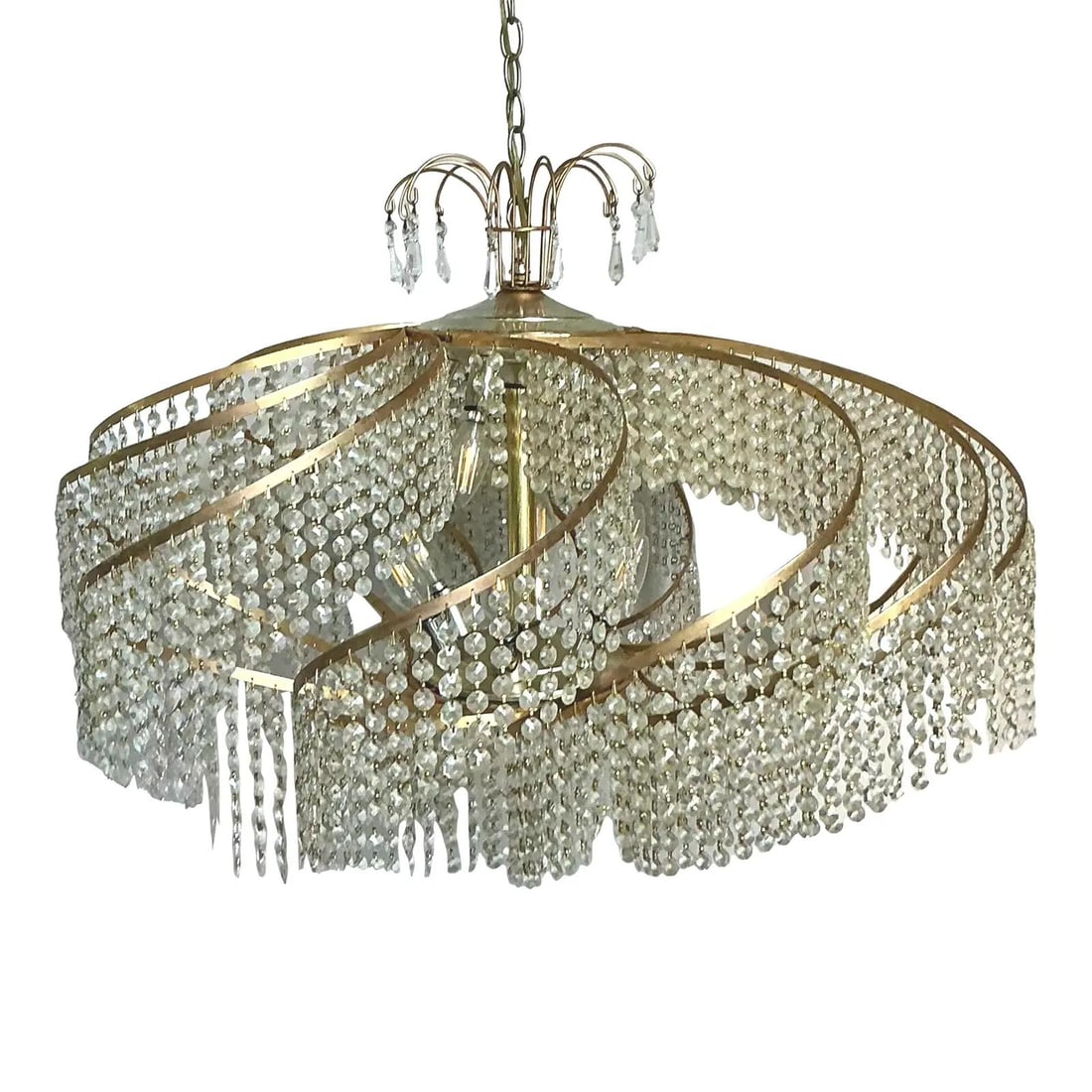 Hollywood Regency Era Large Brass and Crystal Swirl Pendant Chandelier 32" x 23": Hollywood Regency Era Large Brass and Crystal Swirl Pendant Chandelier 32" x 23" This vintage Belgian crystal swirl chandelier exemplifies the glamour of the Hollywood Regency era with its tiered, swi