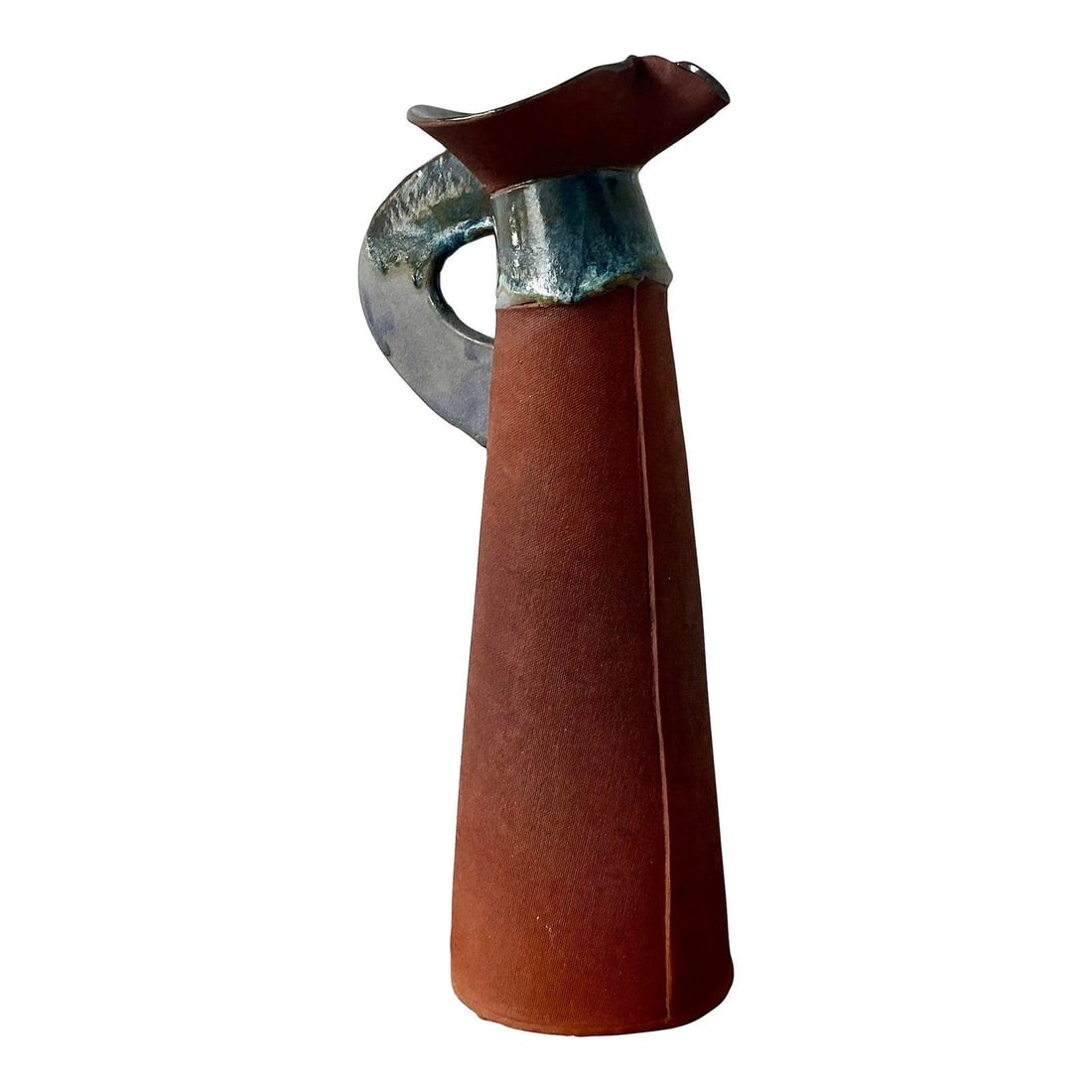 Mid Century Studio Pottery Terracotta and Black Glaze Pitcher: Mid Century Studio Pottery Terracotta and Black Glaze Pitcher This vintage studio pottery pitcher embodies mid-century Brutalist design with its bold, sculptural form and handcrafted elegance. Featuri