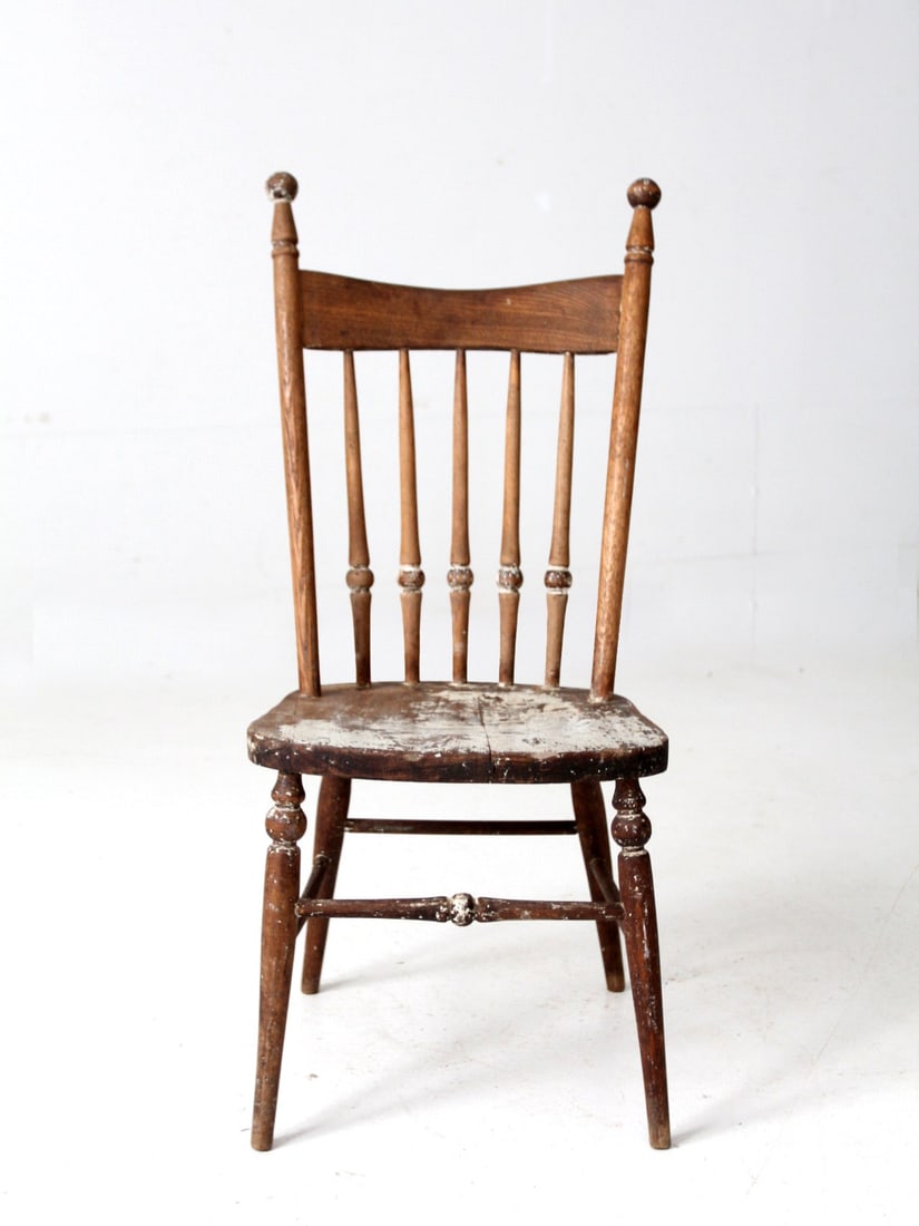 Antique Windsor Style Children's Spindle Back Chair: Antique Windsor Style Children's Spindle Back Chair This antique children's spindle back chair embodies classic Windsor style with its charming spindle back and elegantly turned legs. The chair showca