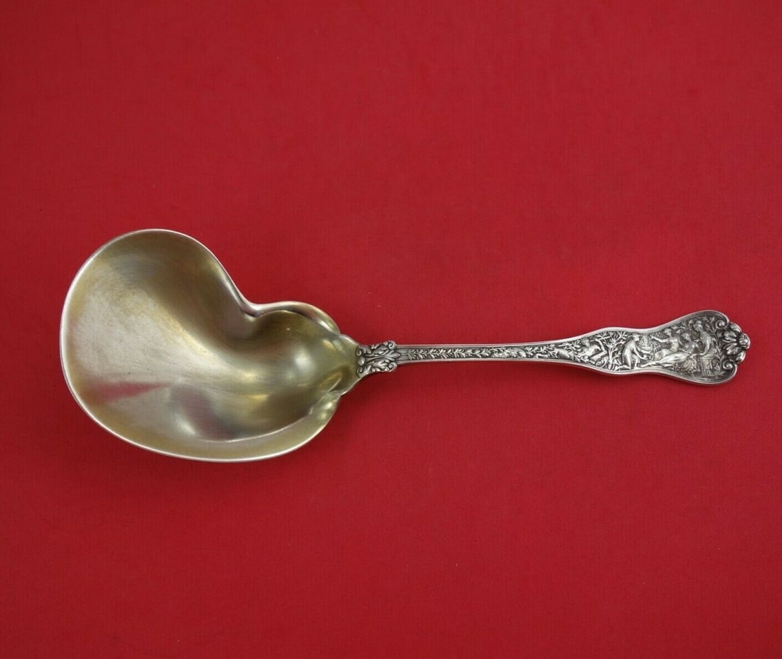 Tiffany & Co Olympian Sterling Silver Berry Spoon 9 1/2" Gold Wash: Tiffany & Co Olympian Sterling Silver Berry Spoon 9 1/2" Gold Wash Indulge in the elegance of the Olympian pattern by Tiffany & Co. This exquisite kidney-shaped berry spoon is crafted from high-qualit