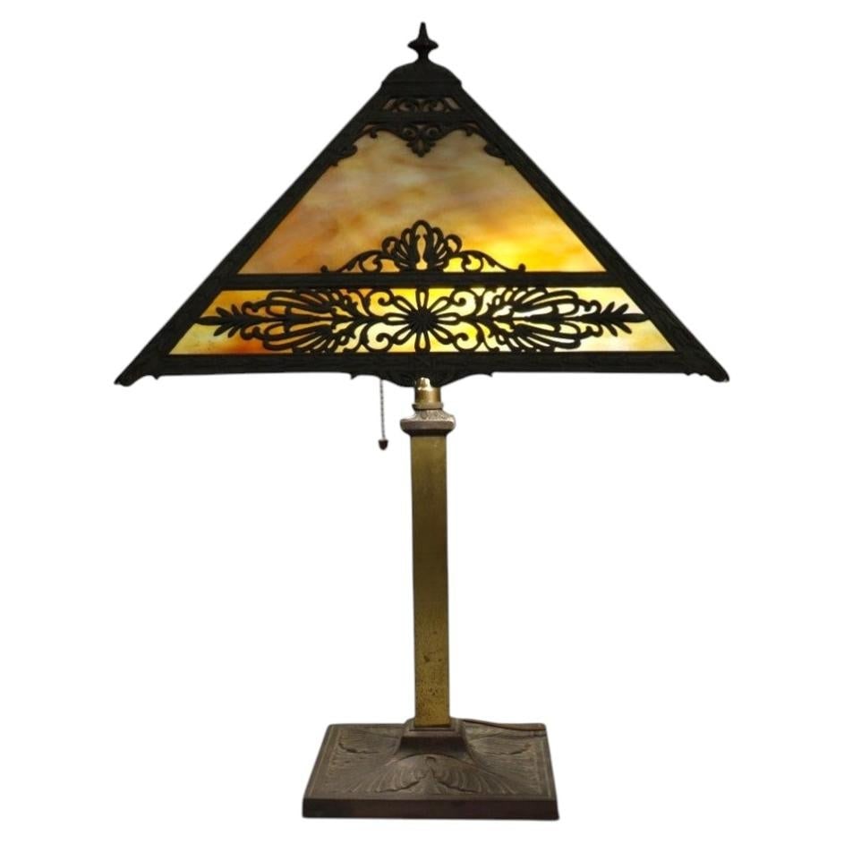 Arts and Crafts Bradley Hubbard slag glass table lamp floral overlay: Arts and Crafts Bradley Hubbard slag glass table lamp floral overlay This antique Arts & Crafts table lamp, attributed to Bradley & Hubbard and dating to circa 1920, features a four-panel pyramidal sh