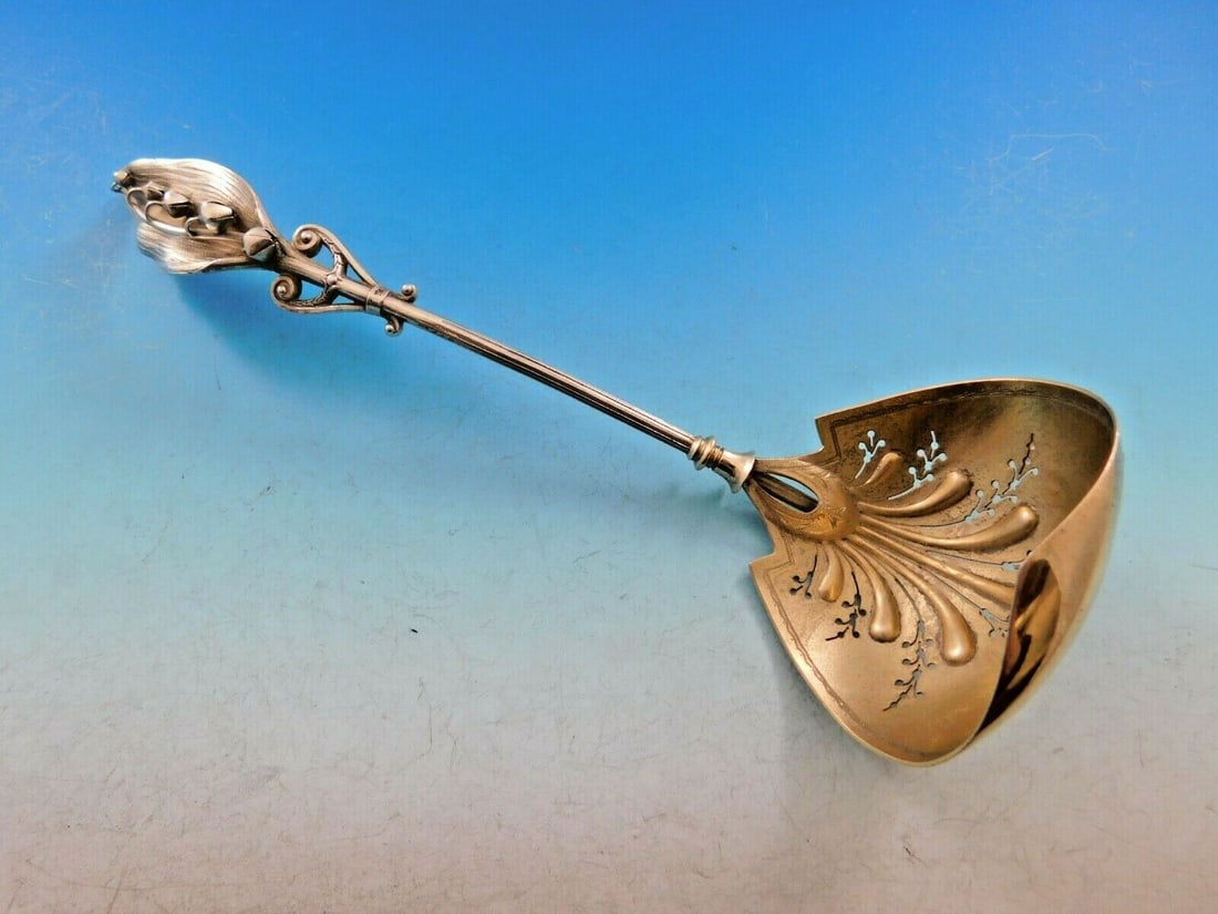Gorham Sterling Silver Sugar Sifter Ladle Lily of the Valley 1865: Gorham Sterling Silver Sugar Sifter Ladle Lily of the Valley 1865 This exquisite Gorham sterling silver sugar sifter ladle, part of the Lily of the Valley pattern, dates back to the mid-19th century (