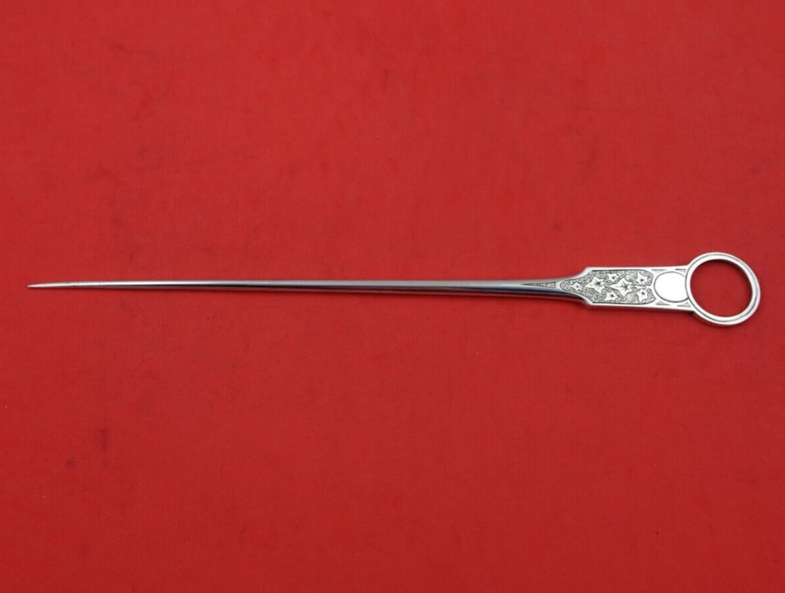 Tiffany & Co Antique Ivy Sterling Silver Skewer 9 1/8 inches: Tiffany & Co Antique Ivy Sterling Silver Skewer 9 1/8 inches This exquisite skewer from Tiffany & Co. features the elegant Antique Ivy engravings, showcasing the brand's renowned craftsmanship. Made o