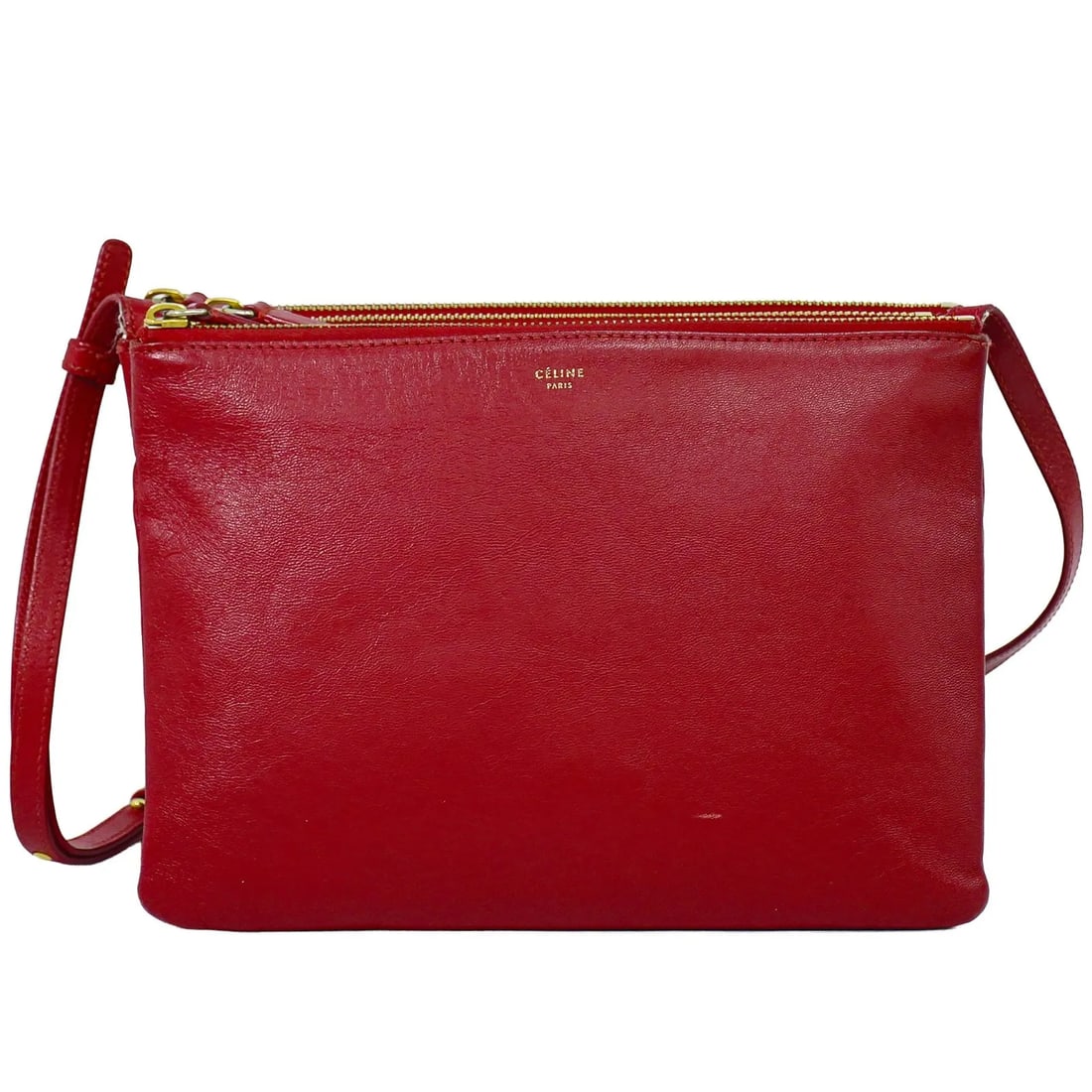 Celine Trio red leather shoulder bag: Celine Trio red leather shoulder bag Celine Trio leather bag in red. This women's bag is made in Italy and remains in good condition overall, with noted wear including slight scuffing and cracking at 