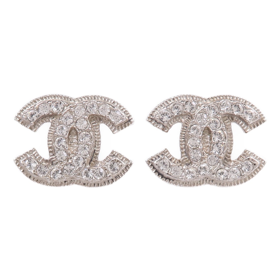 Clear Metal Pierced Earrings by CHANEL with CC Logo: Clear Metal Pierced Earrings by CHANEL with CC Logo These CHANEL CC pierced earrings feature a clear design crafted from unspecified metal and materials. Designed for women, these earrings showcase th