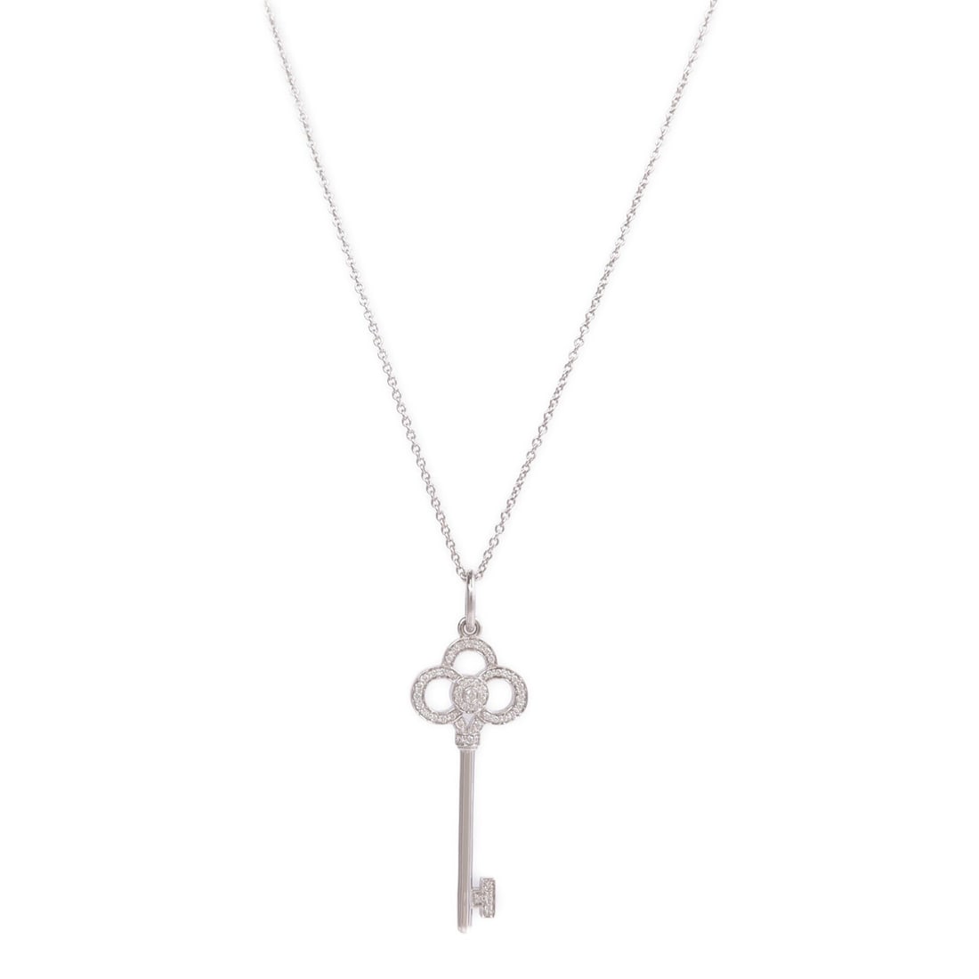 Tiffany & Co Diamond Keys 18K White Gold Necklace: Tiffany & Co Diamond Keys 18K White Gold Necklace This Tiffany & Co. Keys necklace features a delicate key motif crafted from 18K white gold and adorned with a clear diamond. Designed for women, it sh