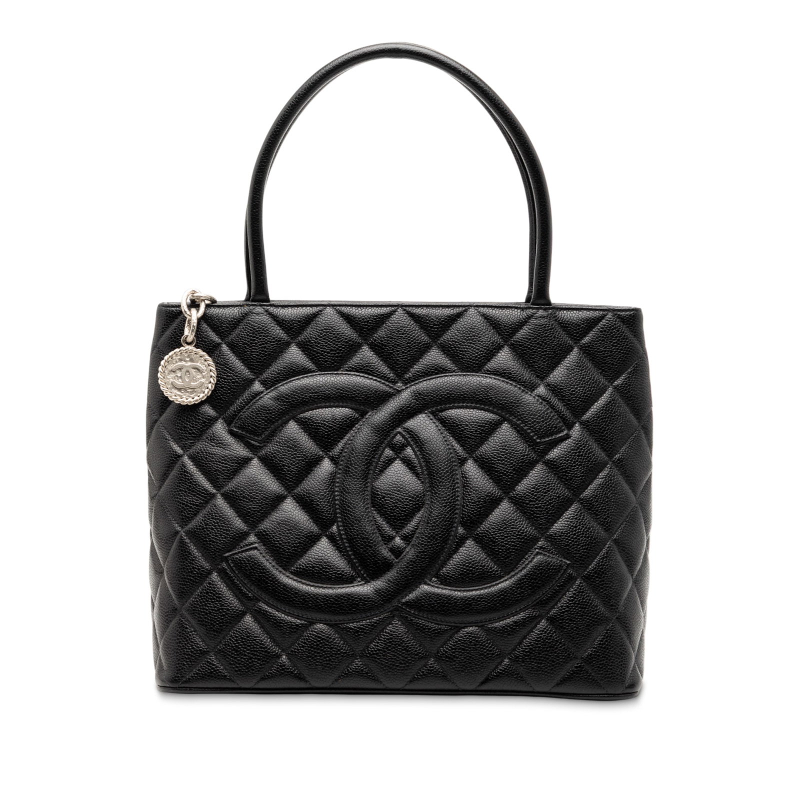 Black Chanel Quilted Caviar Leather Medallion Tote Bag with Zip Closure: Black Chanel Quilted Caviar Leather Medallion Tote Bag with Zip Closure This Chanel Caviar Medallion Tote features a quilted caviar leather body in black, rolled leather handles, a top zip closure, an