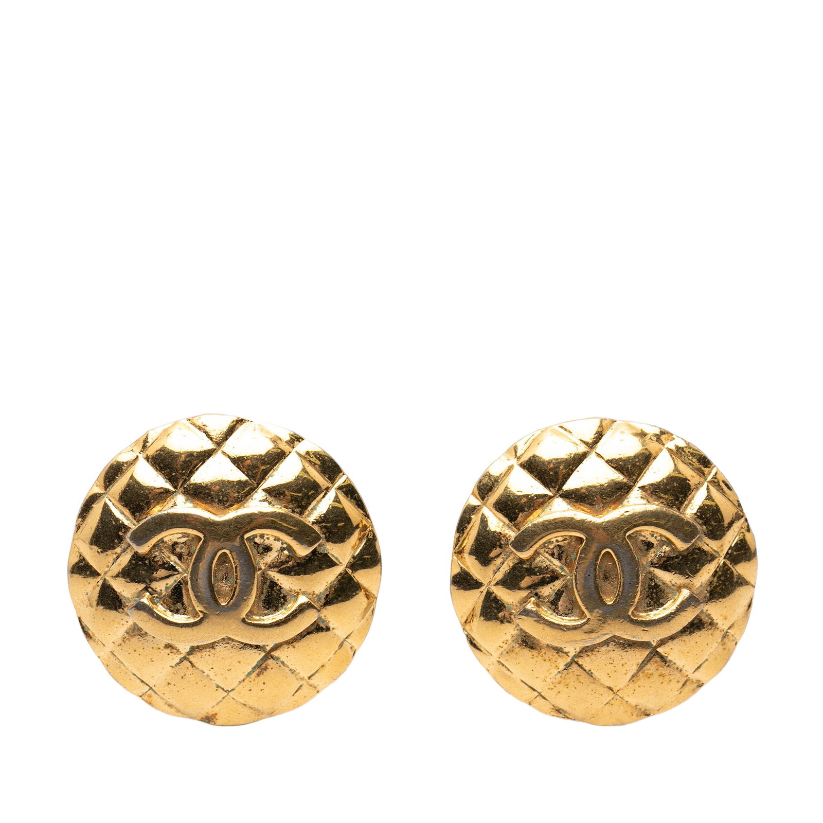 Chanel Gold Plated Quilted Metal Round Clip On Earrings: Chanel Gold Plated Quilted Metal Round Clip On Earrings These Chanel CC clip-on earrings feature a round design with quilted gold-plated metal bodies. Designed for non-pierced ears, they showcase the 