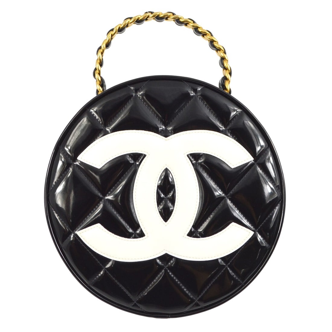 CHANEL Quilted Round Vanity Bag in Black Patent Leather: CHANEL Quilted Round Vanity Bag in Black Patent Leather Chanel round vanity handbag in black patent leather with a zip closure and top handle. This medium satchel/top handle bag features an interior p