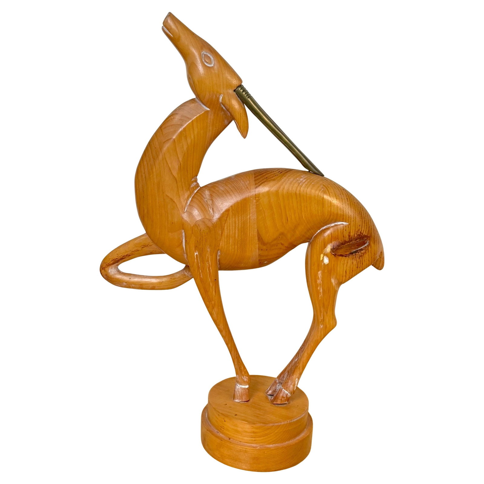Mid-Century Italian Pine and Brass Deer Figure from the 1970s: Mid-Century Italian Pine and Brass Deer Figure from the 1970s This Italian deer sculpture, crafted in the 1970s, combines hand-carved limed pine with refined brass detailing. Featuring stylized, elong