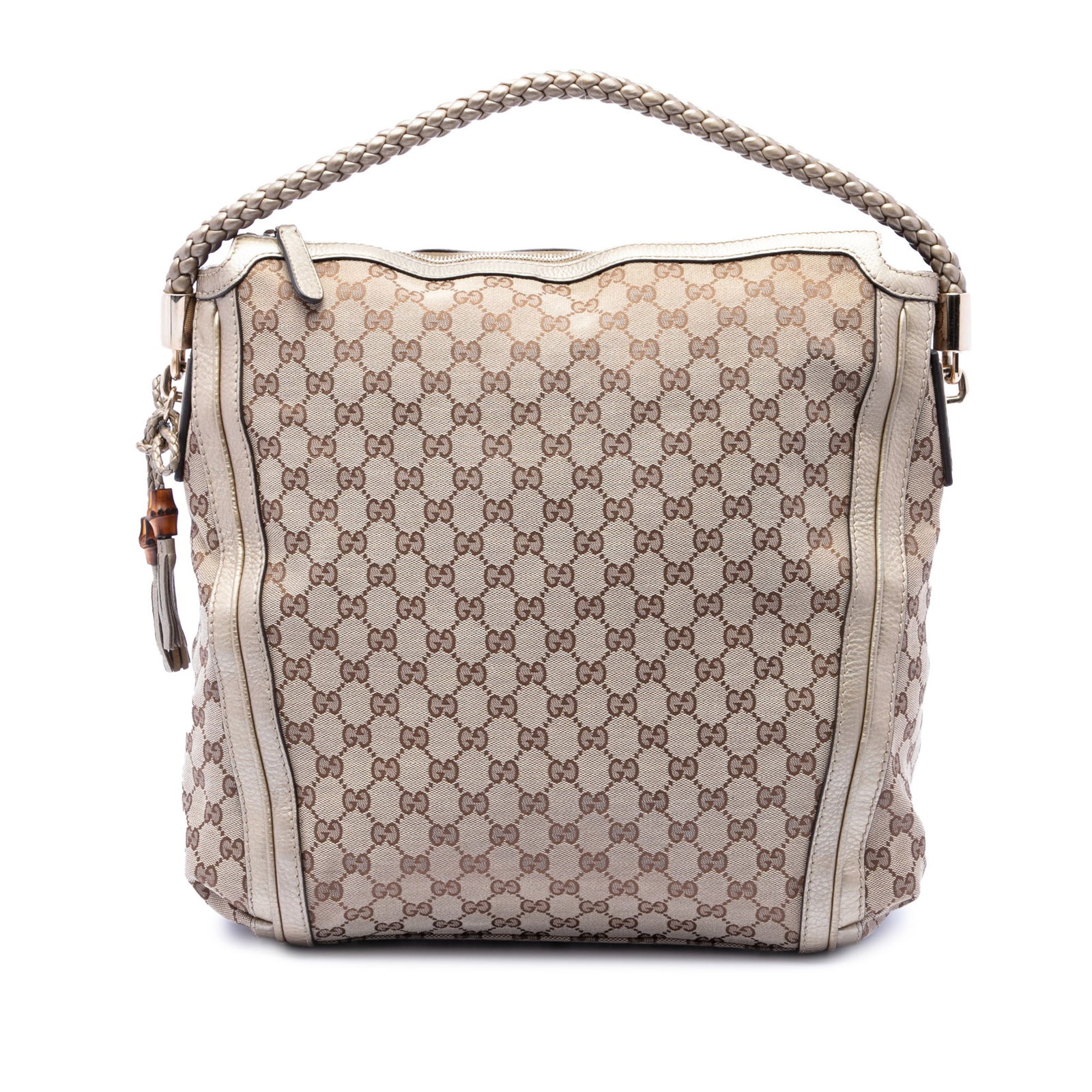 Gucci Bella Tote in GG Canvas with Leather Trim: Gucci Bella Tote in GG Canvas with Leather Trim This Gucci Large GG Canvas Bella Tote features a beige canvas exterior with leather trim and a braided leather handle. The bag is designed with a top zi