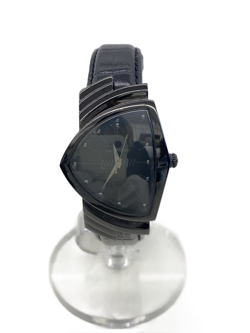 Hamilton Ventura Quartz Black Leather Strap Wristwatch: Hamilton Ventura Quartz Black Leather Strap Wristwatch This is a pre-owned Hamilton Ventura Quartz H244010 men's wristwatch featuring a Swiss-made movement. The watch has a black dial and comes with a