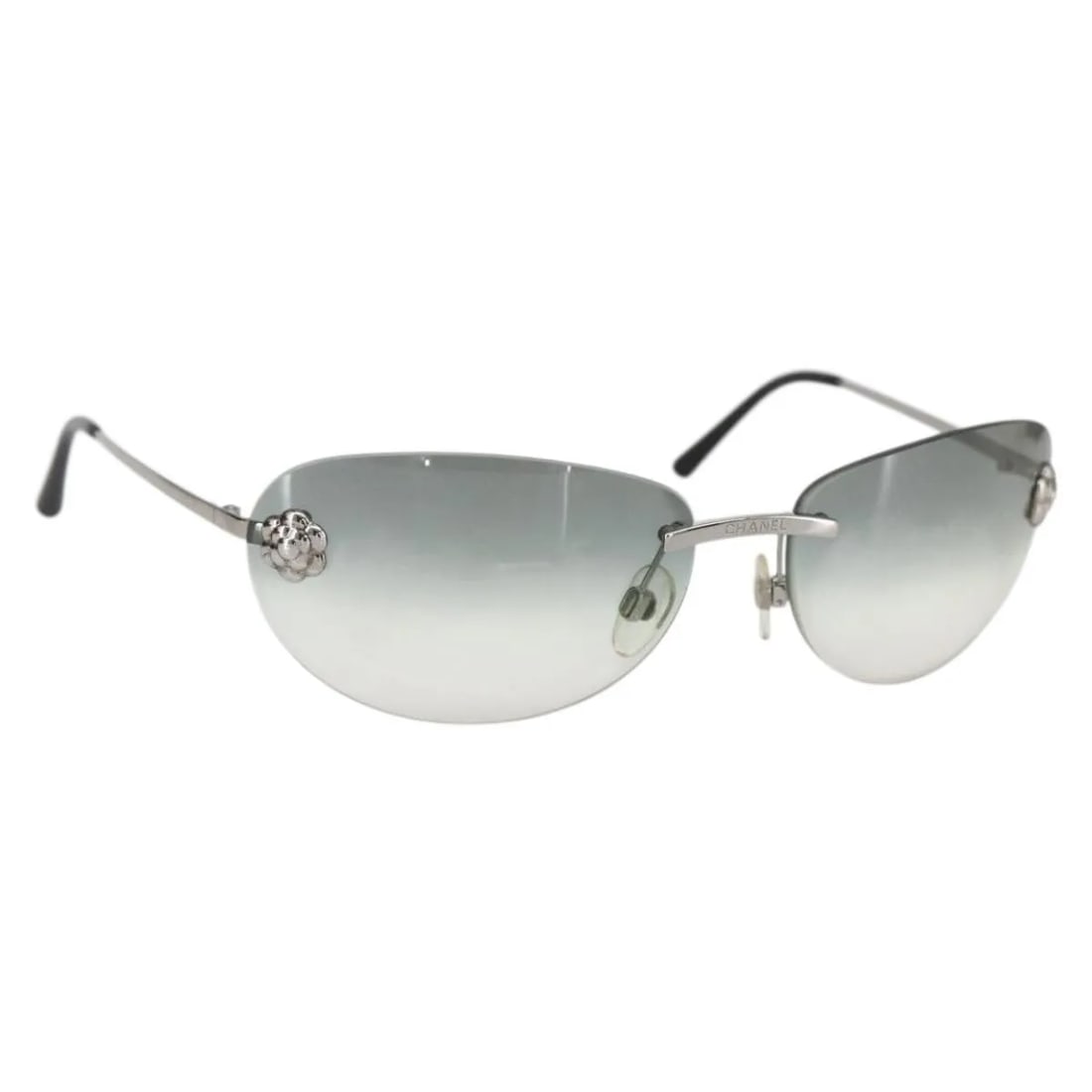 Chanel Camelia black metal sunglasses for women: Chanel Camelia black metal sunglasses for women Chanel Camelia sunglasses feature a black metal frame designed for women. This pre-owned pair is in very good condition with minimal surface rubbing and
