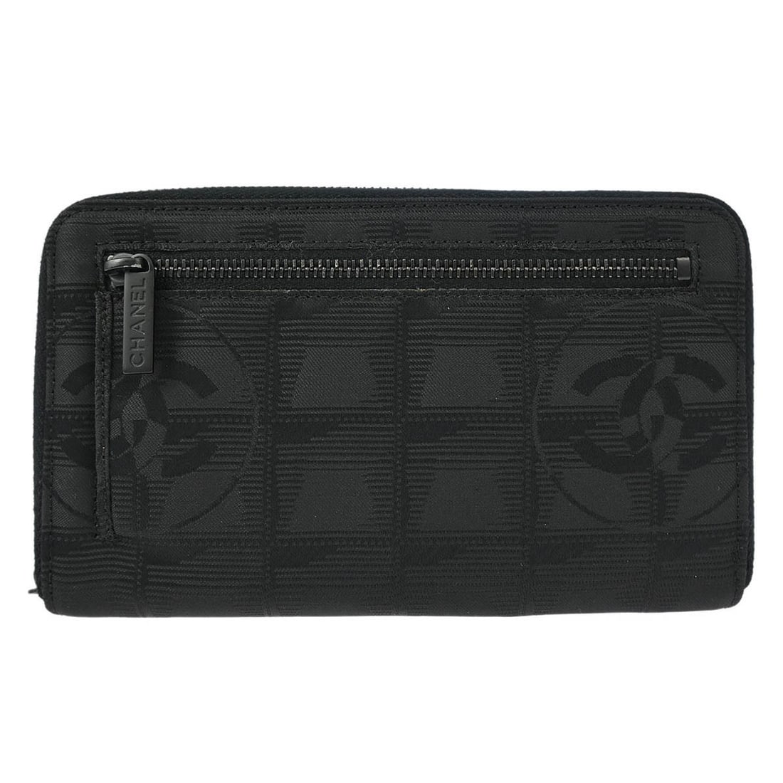 CHANEL Travel Line quilted nylon wallet in black: CHANEL Travel Line quilted nylon wallet in black Vintage Chanel Travel Line wallet purse in black quilted nylon with a zip closure and logo zipper accent. The interior includes multiple compartments f